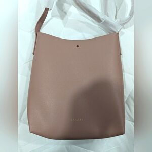 Samara over the shoulder or cross body purse. Dirty pink in color. NWOT